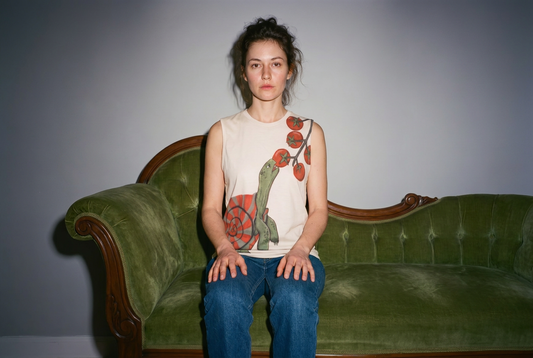 Woman with Turtle eating tomatoes tank top on sofa