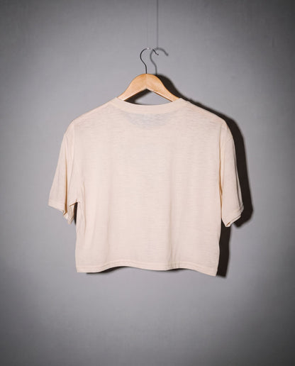Back view of warm cream boxy fit short sleeve crop top with rounded neckline