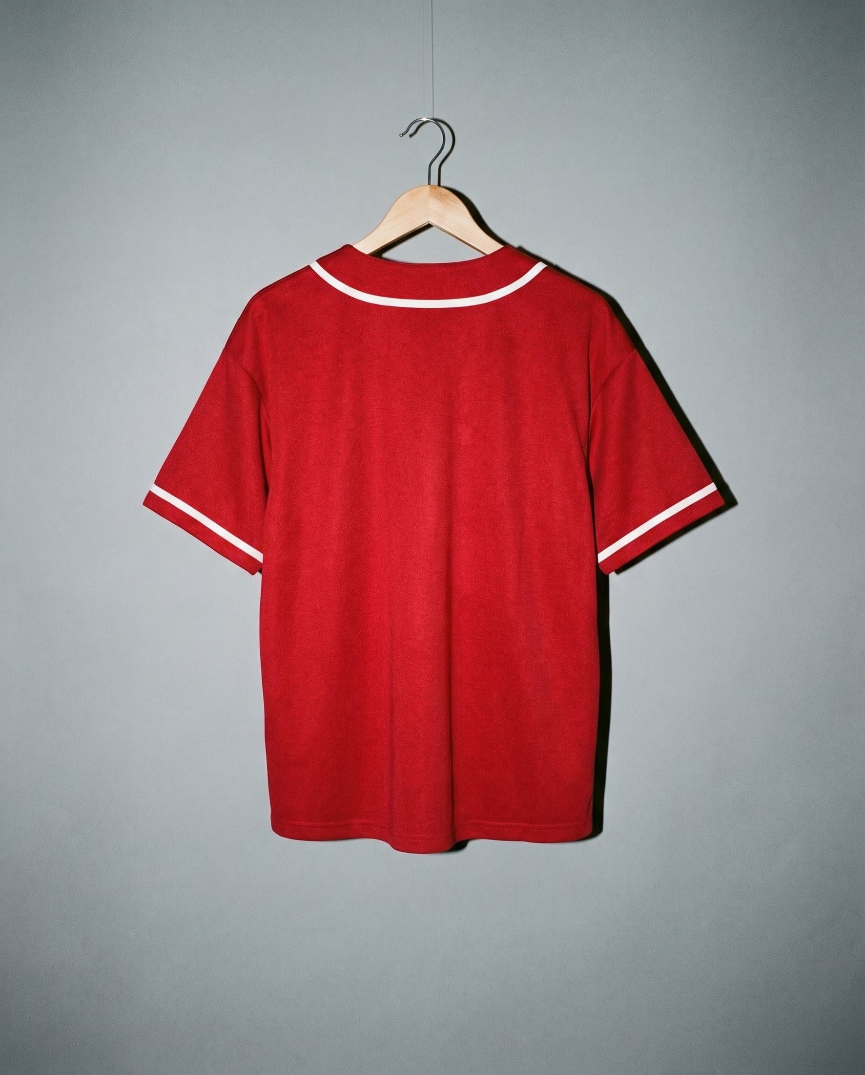 Red loose fit short sleeve button up shirt with white trim and textured knit fabric