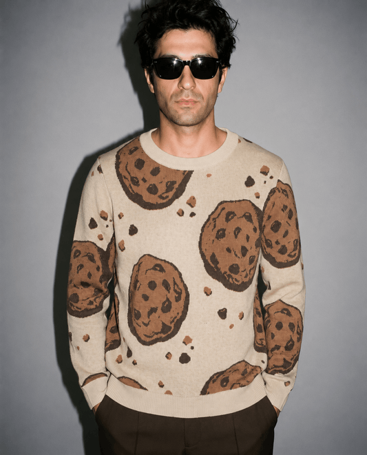 Beige crew neck sweater with chocolate chip cookies and crumbs detail