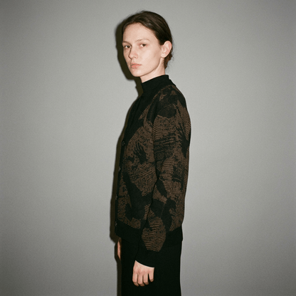Side profile of open V-neck knit cardigan featuring abstract bird pattern