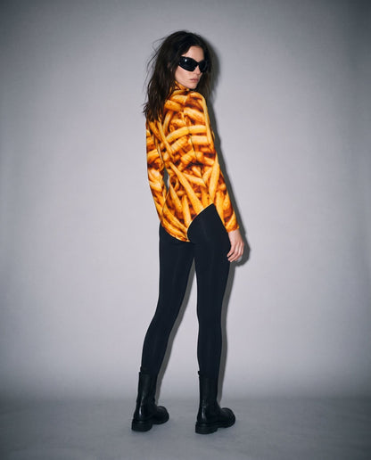 Side fit of french fry print scuba fabric bodysuit on model