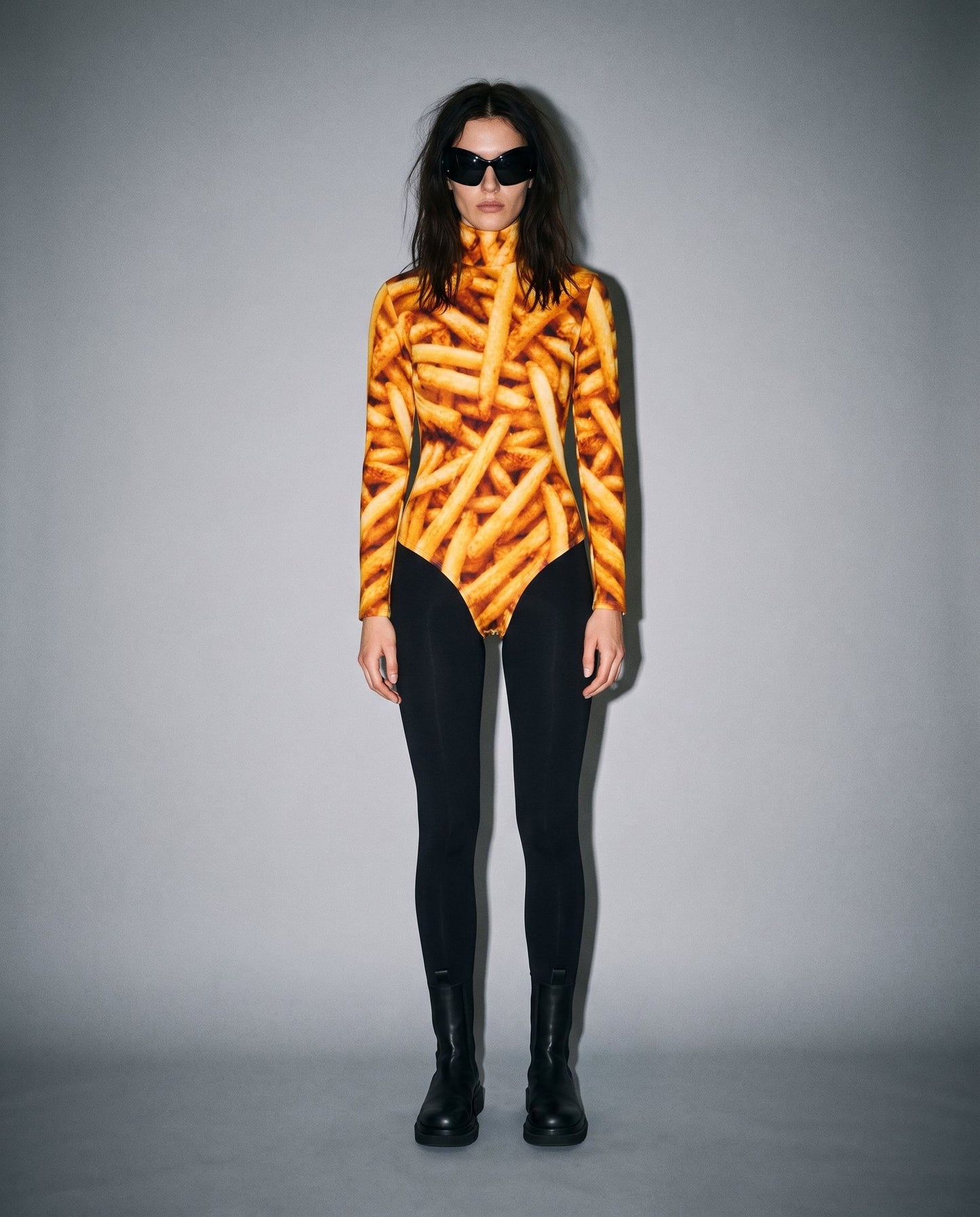 French fry print long sleeve bodysuit on model with black leggings