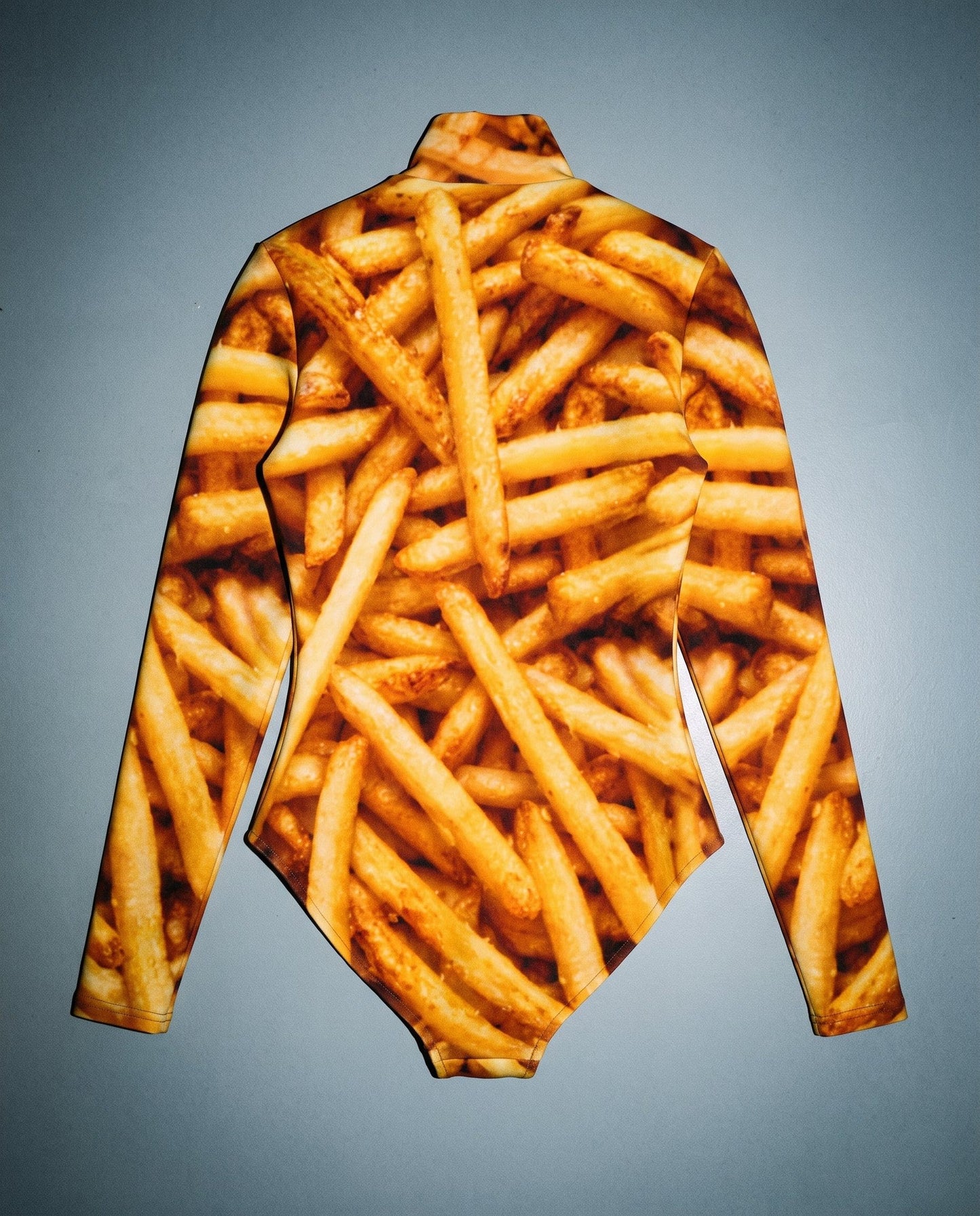 Back view of french fry photographic print bodysuit laid flat