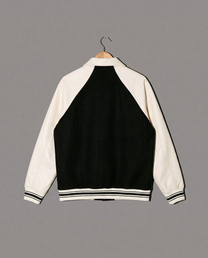 Black and cream varsity jacket back view with striped hem