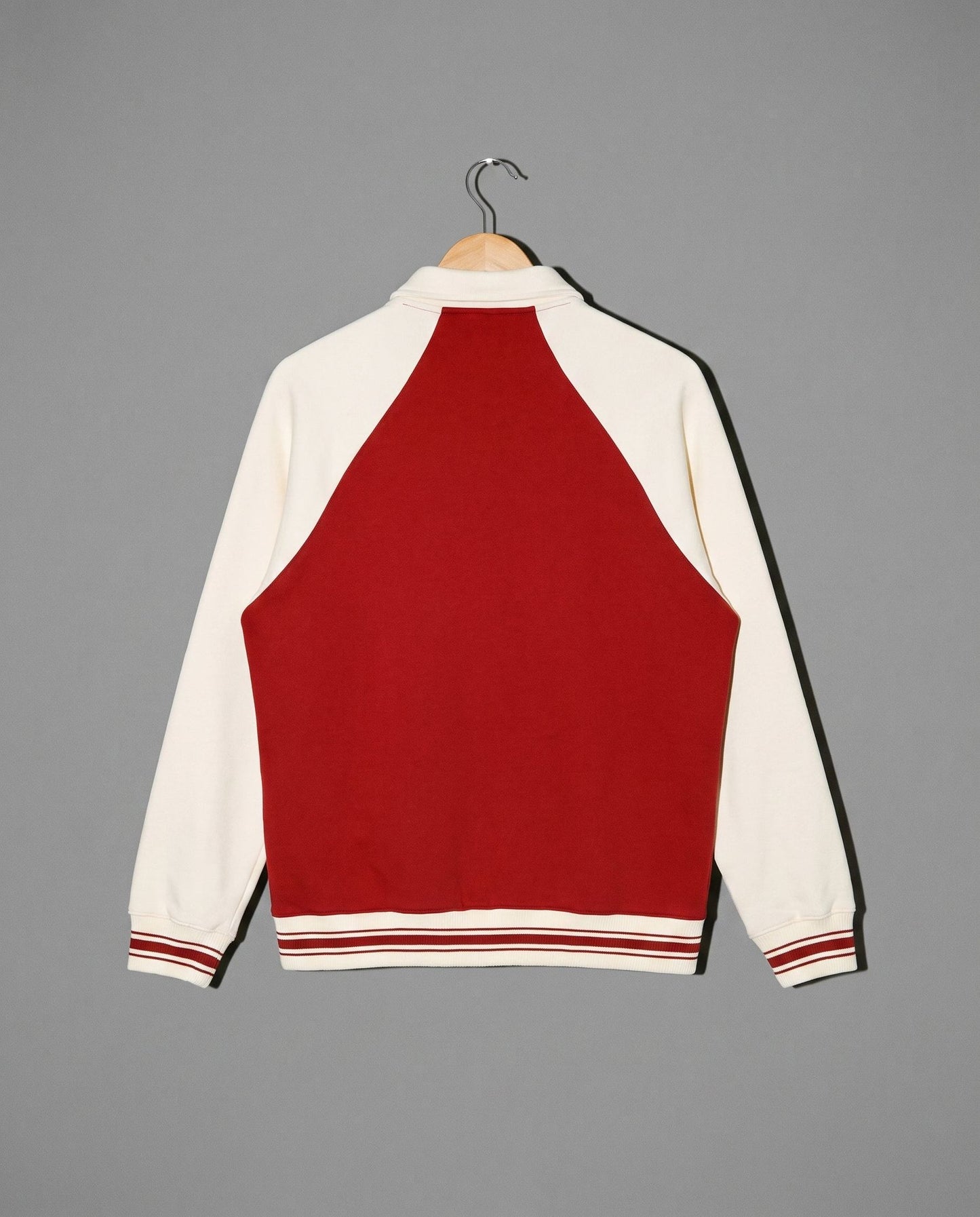 Red and cream varsity jacket back view with striped collar