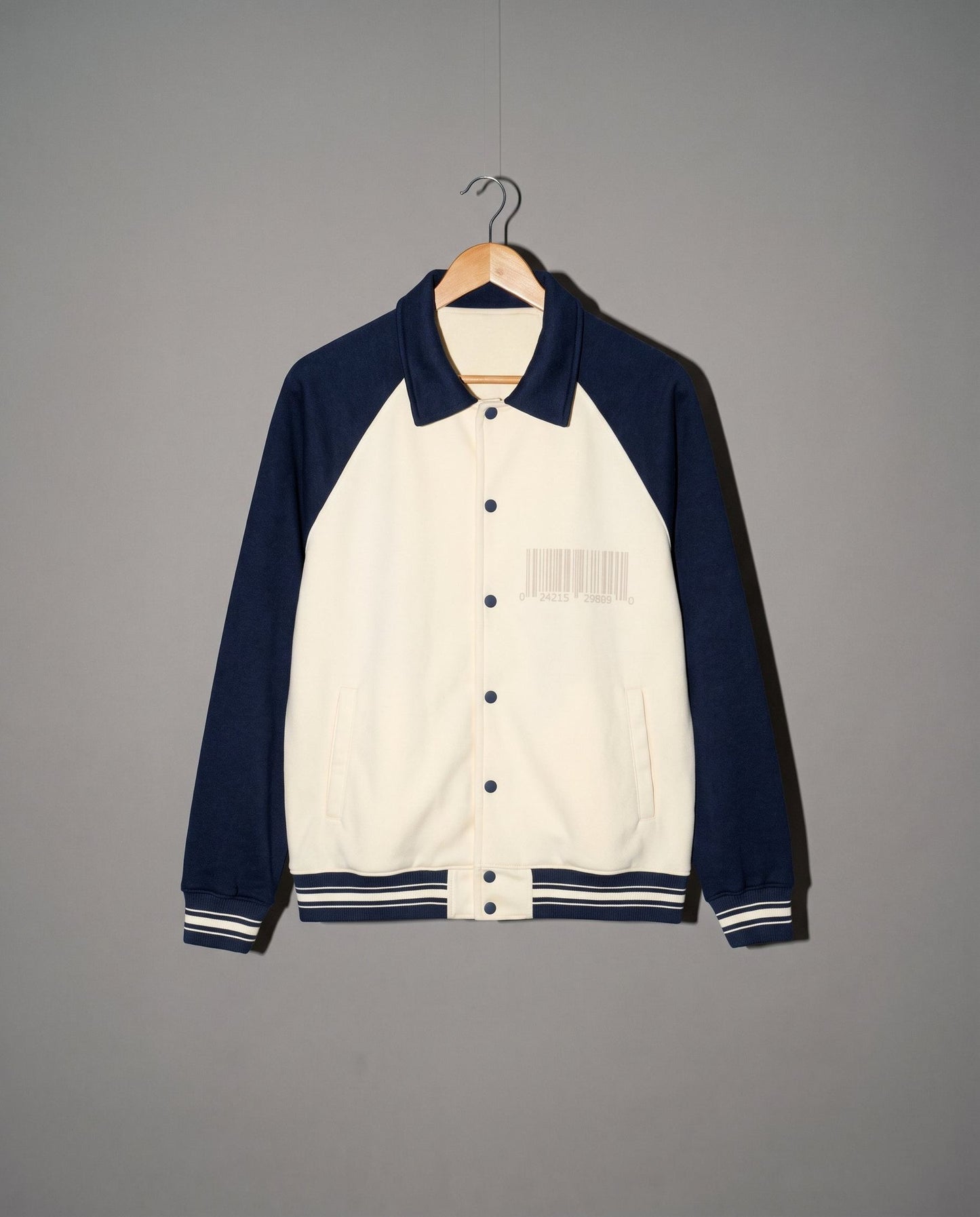 Cream and navy varsity jacket front with gray barcode