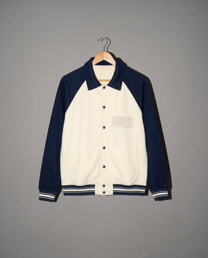 Cream and navy varsity jacket front with gray barcode