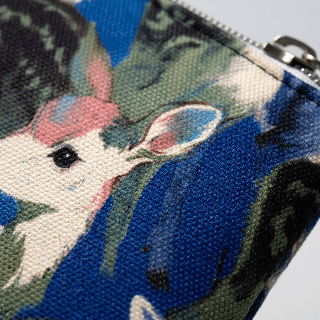 Close-up of fawn illustration texture on blue pencil case fabric