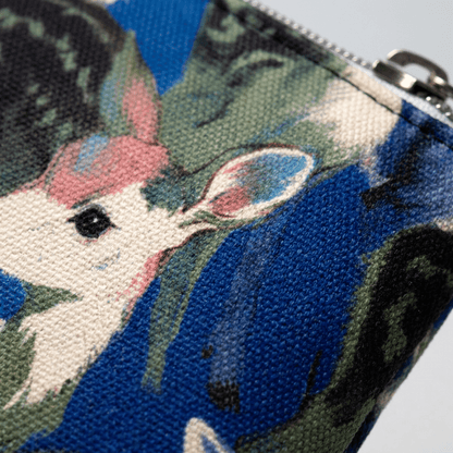 Close-up of fawn illustration texture on blue pencil case fabric