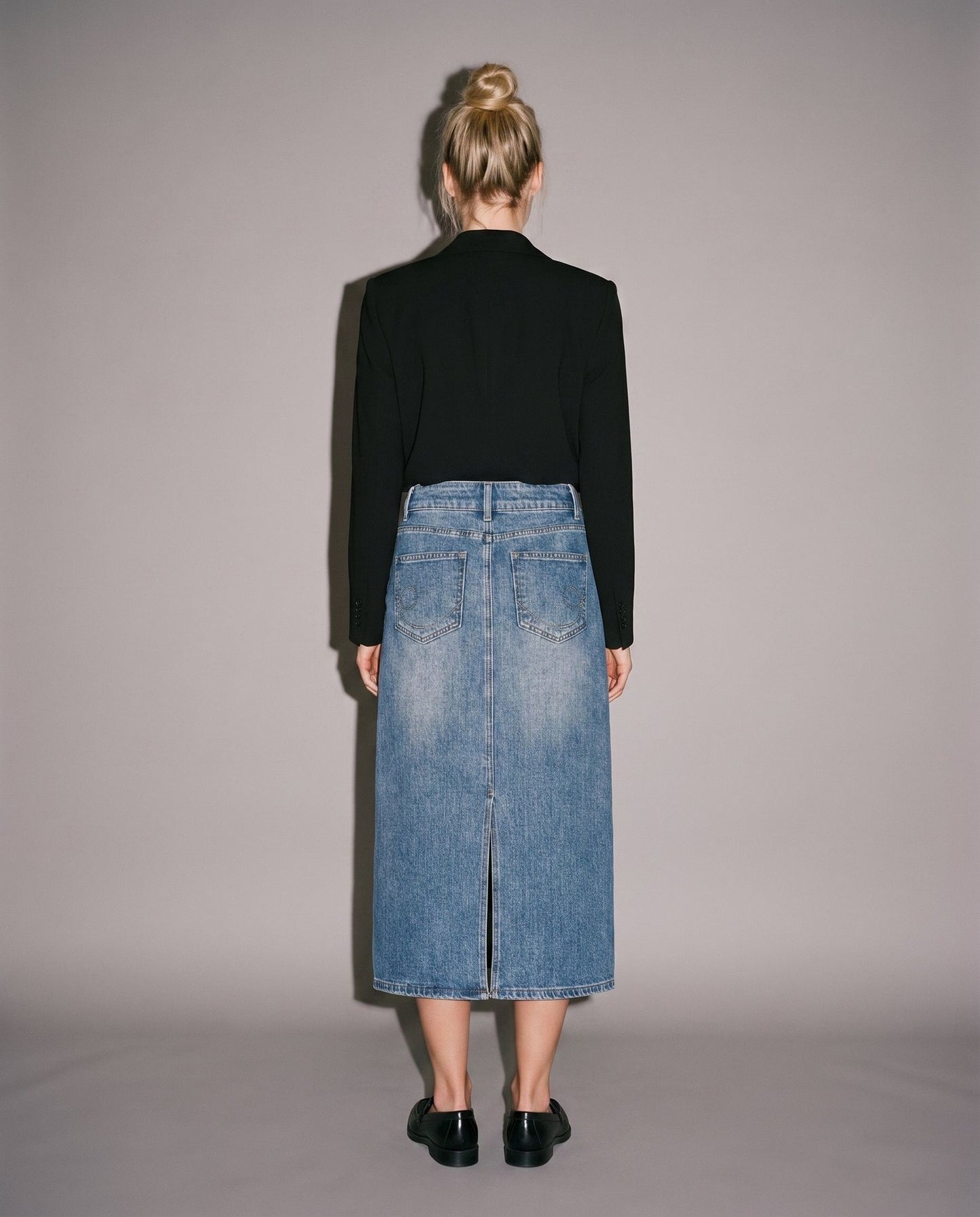 Black blazer and blue denim midi skirt with back slit and pockets
