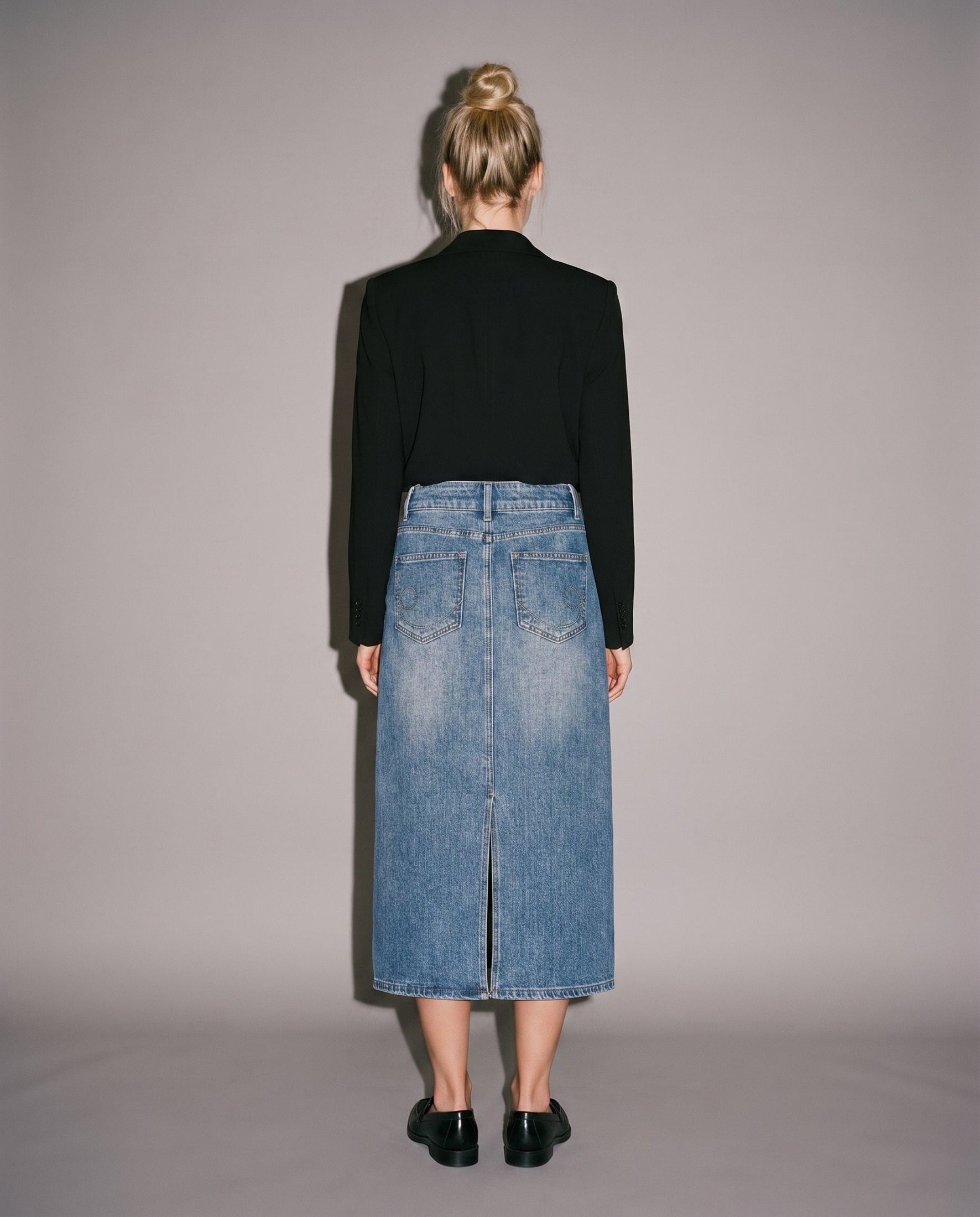 Black blazer and blue denim midi skirt with back slit and pockets
