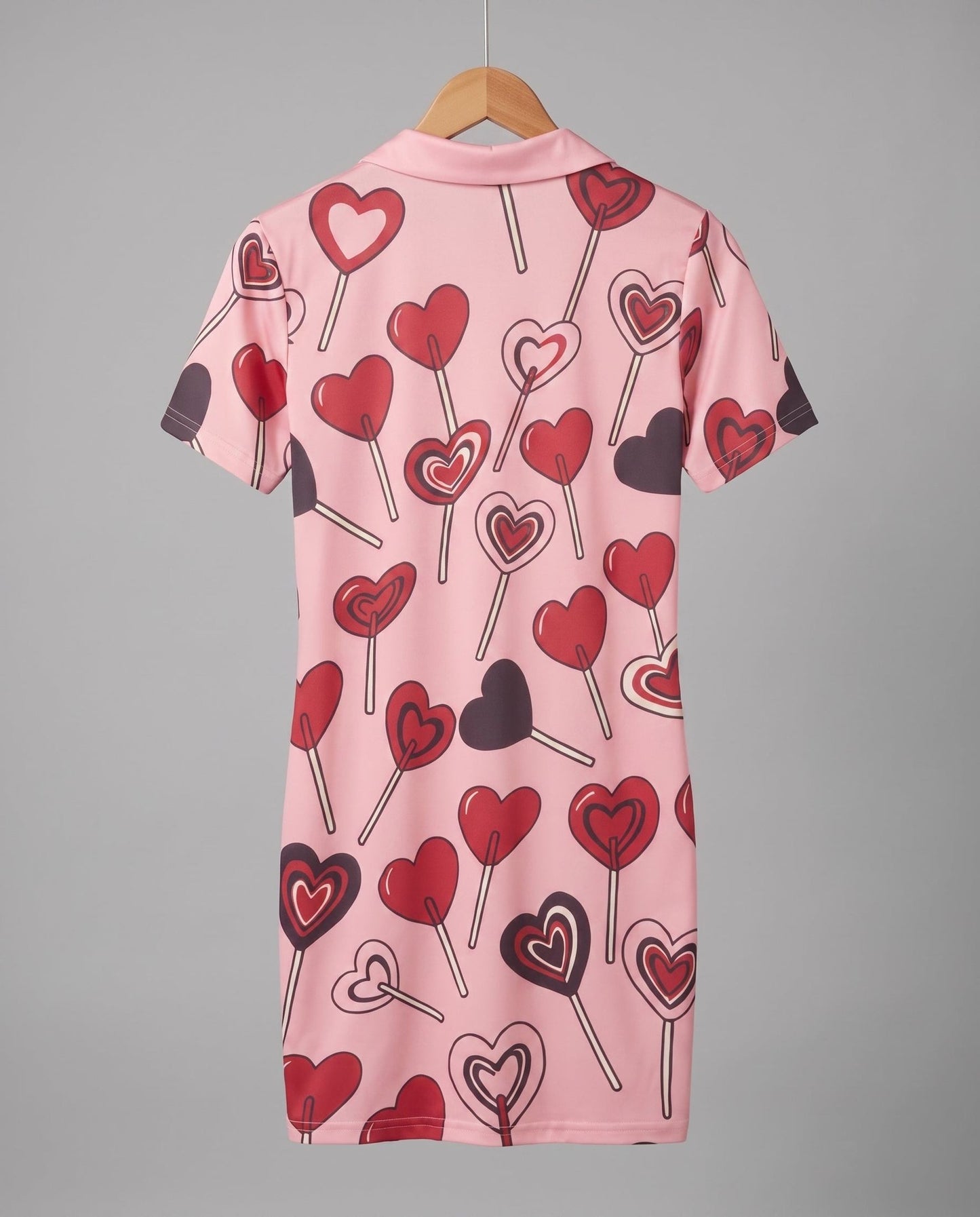 Pink fitted polo dress with heart lollipop print back view