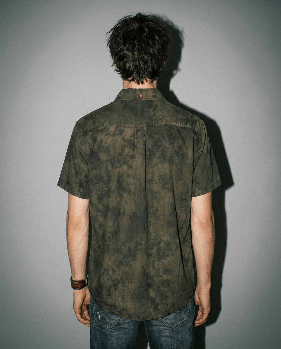 Back view of MILDEW relaxed fit short sleeve button up shirt with earth tone foliage pattern