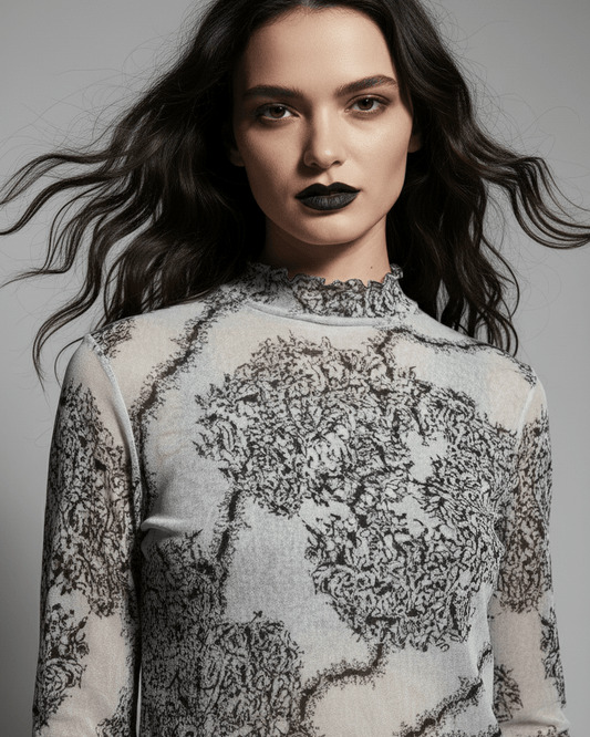 Sheer mesh long sleeve top with black ant pattern and ruffled high neck