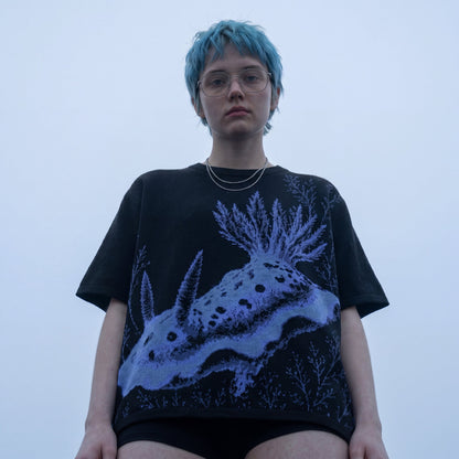 Black nudibranch knit t-shirt with blue and purple sea creature graphic