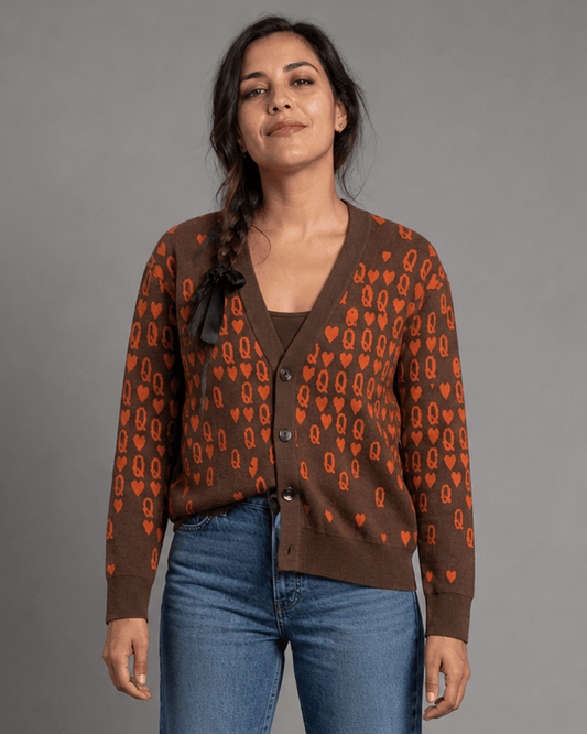 Model wearing brown cardigan with black ribbon shoulder detail