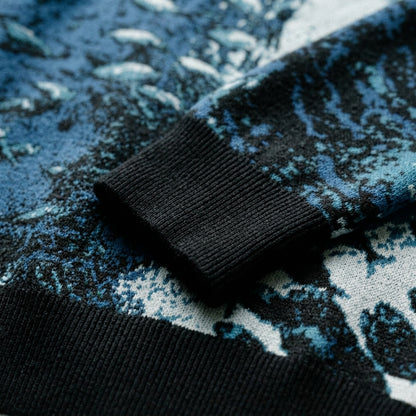 Close-up of textured precision-knit fabric on Riffhaus Sardine School sweater showing underwater fish detail