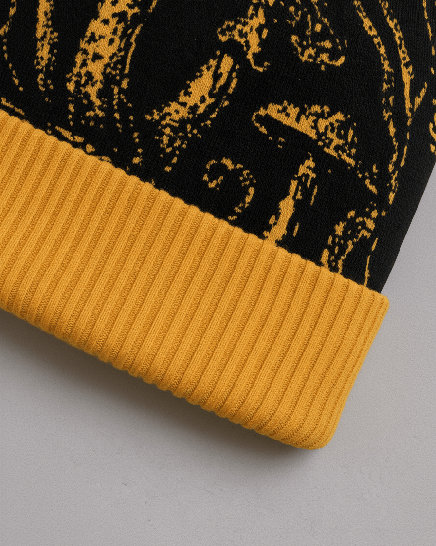 Golden ribbed cuff detail on black SHROOM HEAD knit beanie