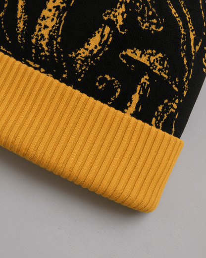 Golden ribbed cuff detail on black SHROOM HEAD knit beanie