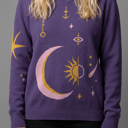 Close-up of purple v-neck sweater intarsia moon eye and star pattern detail
