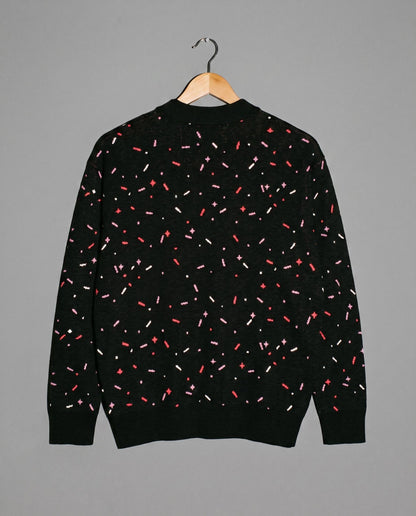 Back view of black confetti pattern knit cardigan with ribbed trim