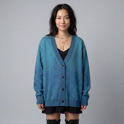 Model wearing blue V-neck cardigan with organic submerged print