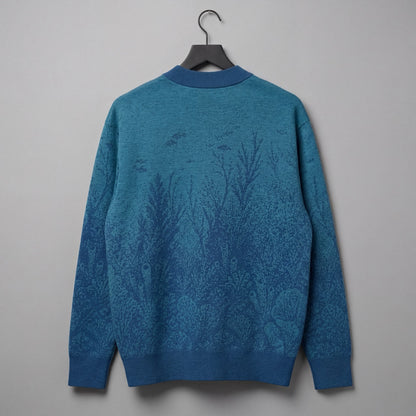 Blue gradient knit cardigan with embedded underwater pattern and ribbed trim