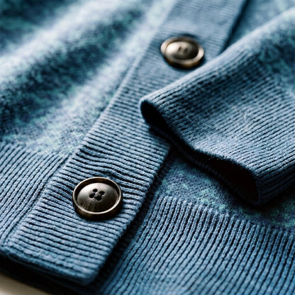 Close-up of brown matte buttons on blue-green tonal knit fabric