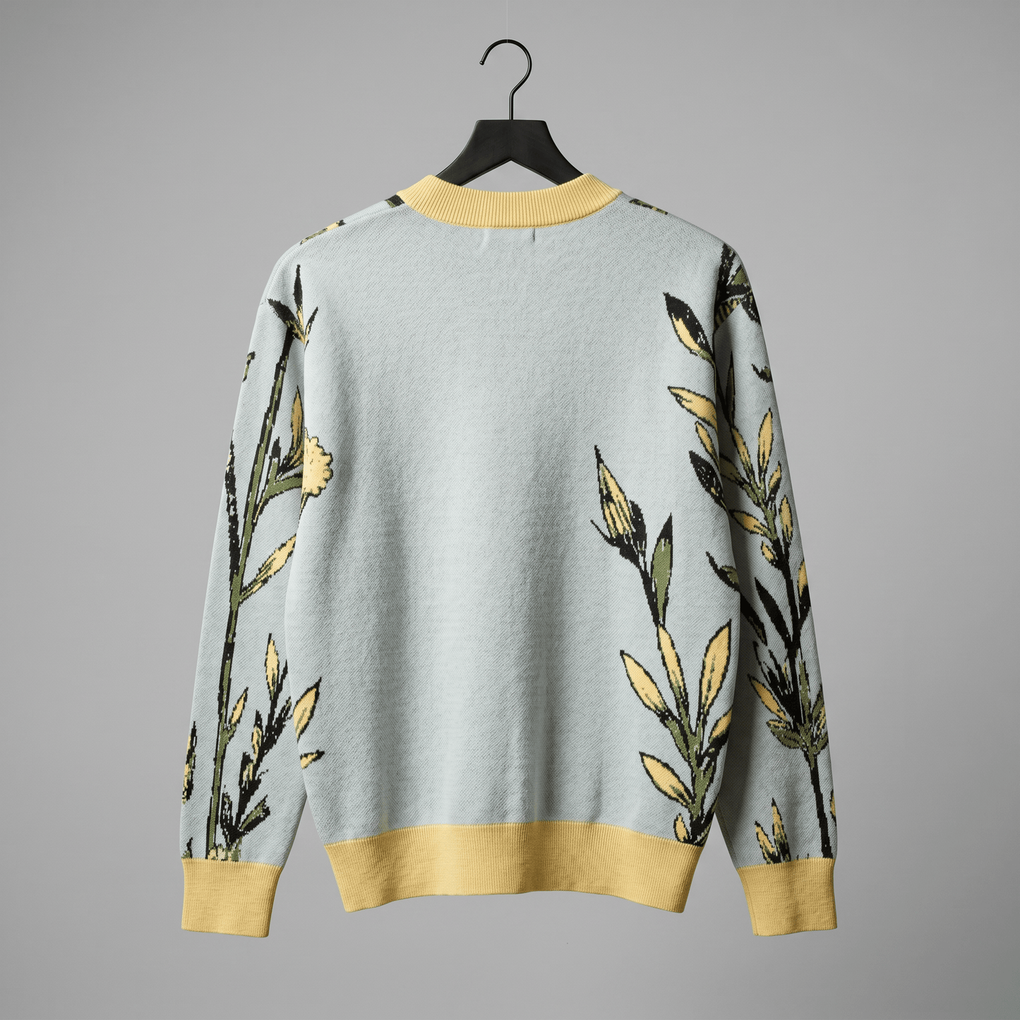 Relaxed fit light blue knit cardigan with dropped shoulder and yellow hem