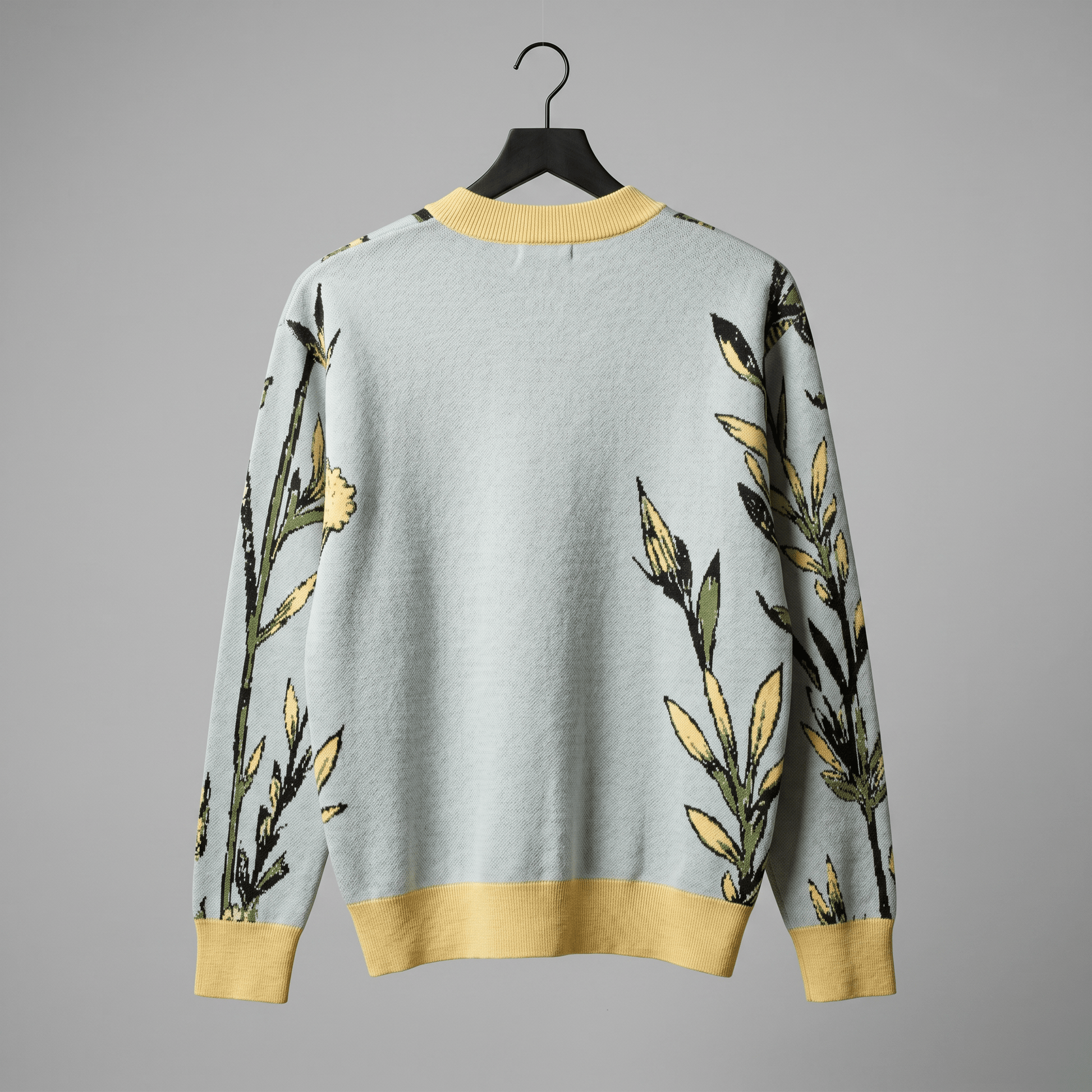 Relaxed fit light blue knit cardigan with dropped shoulder and yellow hem