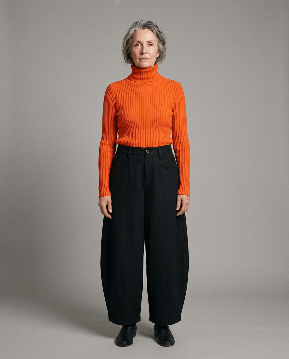Front view of black high-waisted wide-leg trousers with visible pockets