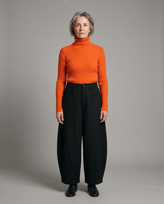Front view of black high-waisted wide-leg trousers with visible pockets