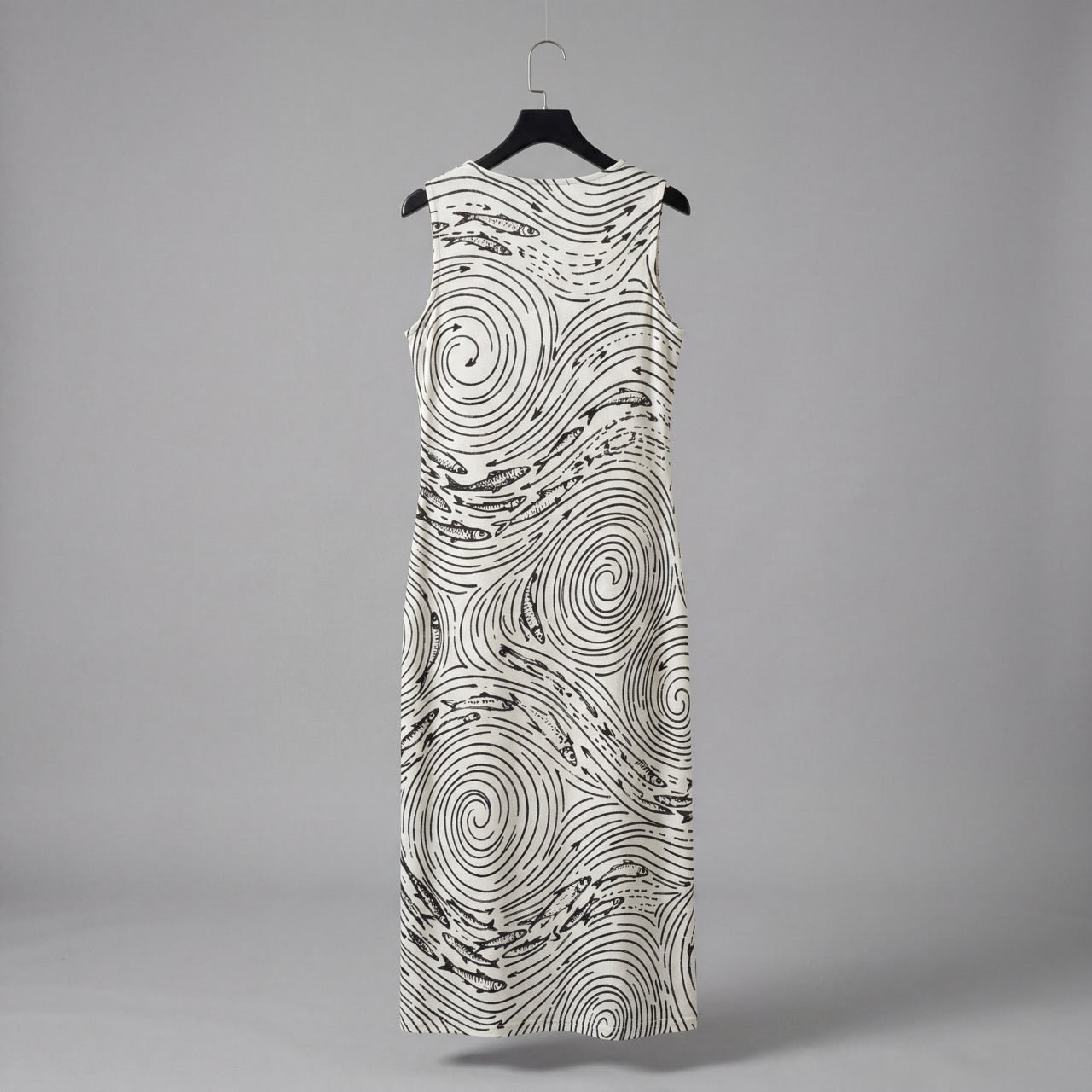 Back view of fitted off-white jersey dress with continuous black wave print