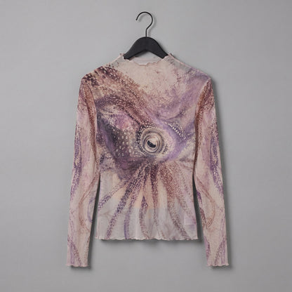 Rear angle of The Teacher high neck top featuring central octopus eye motif