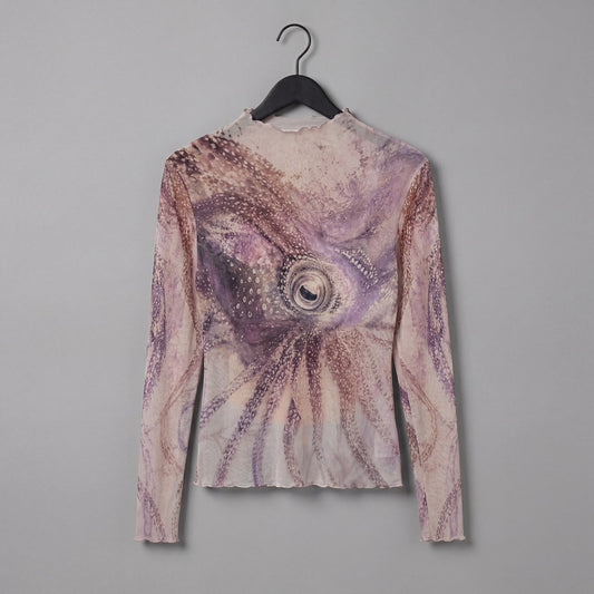 Rear angle of The Teacher high neck top featuring central octopus eye motif