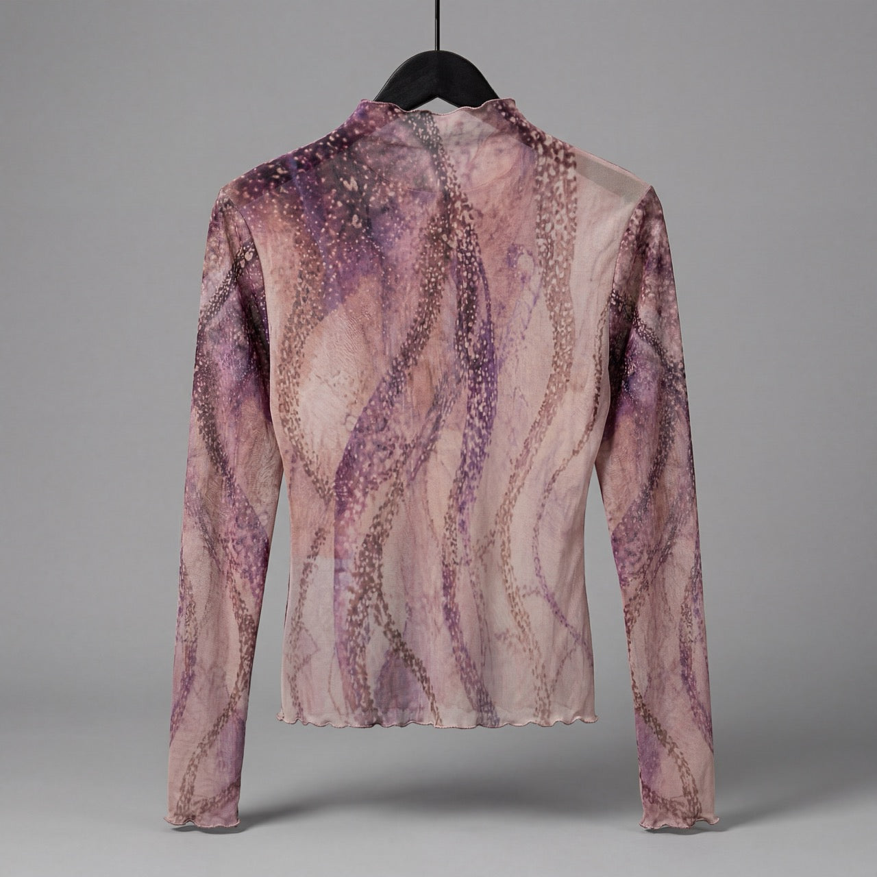 Back view of The Teacher semi-sheer octopus art top showing dissolving arm pattern