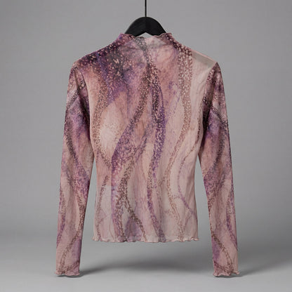 Back view of The Teacher semi-sheer octopus art top showing dissolving arm pattern