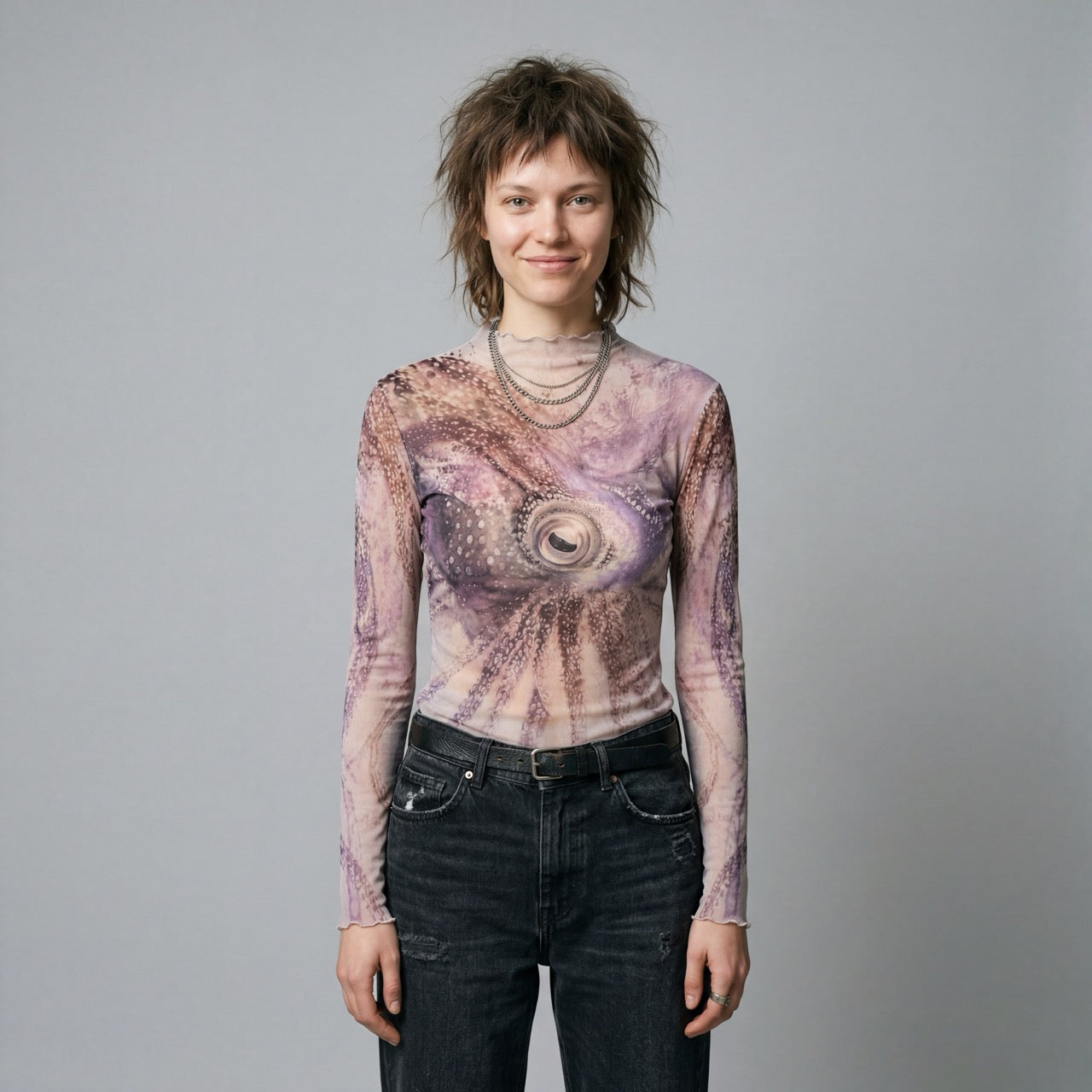 The Teacher octopus print long sleeve top with ruffled neckline in soft mauve and beige