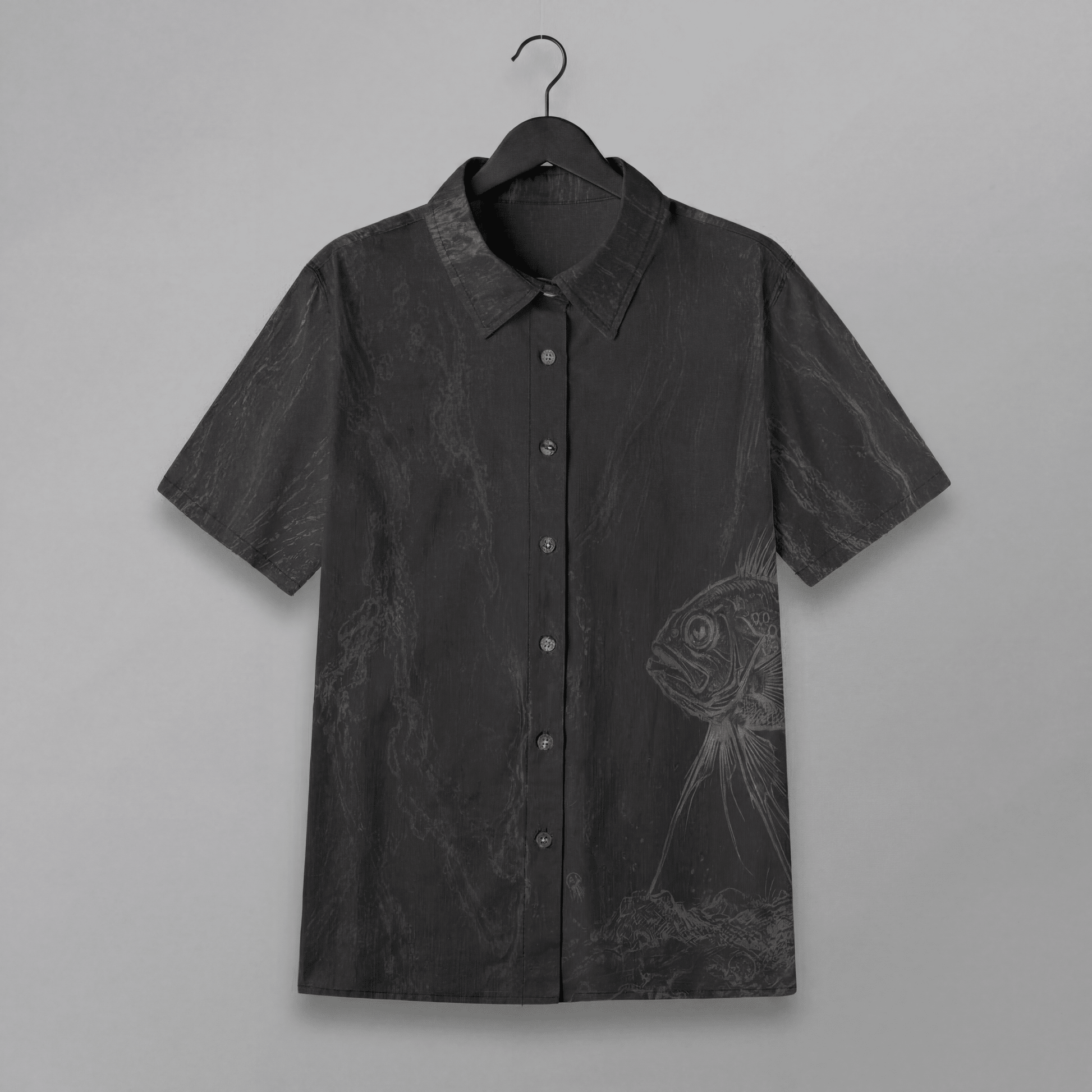 Front view of dark gray slub cotton short sleeve button up shirt with fish print