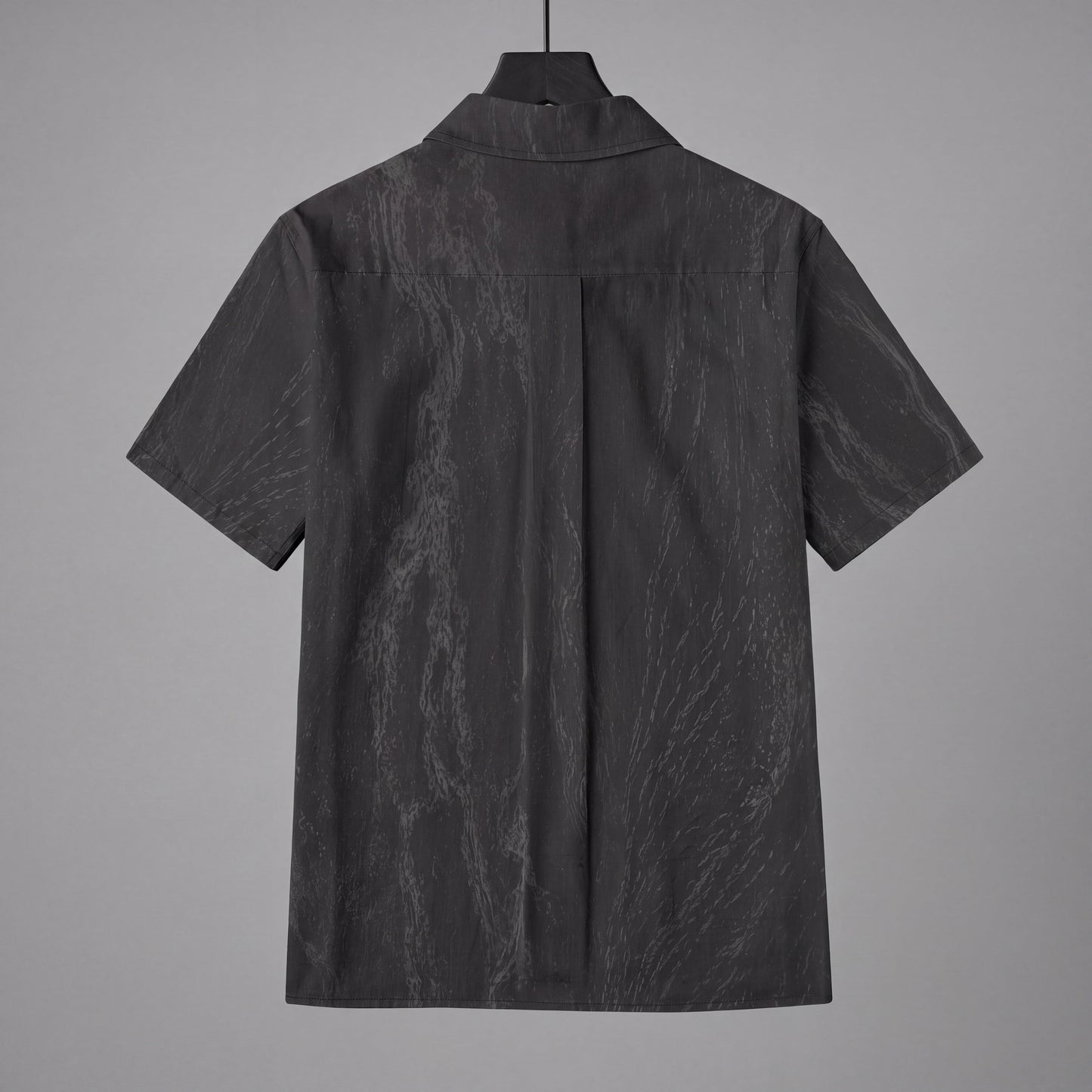 Back view of dark gray slub cotton short sleeve button up shirt on hanger