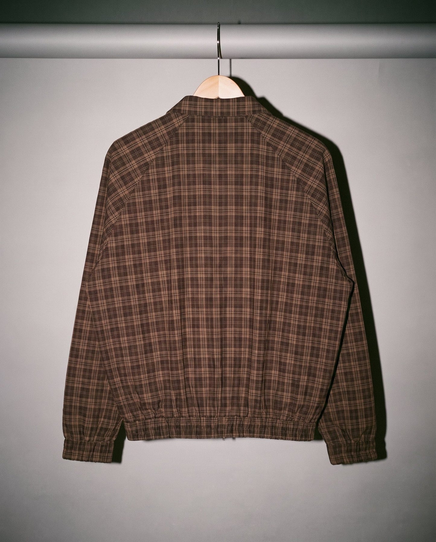Brown plaid oversized cropped jacket back view with raglan sleeves