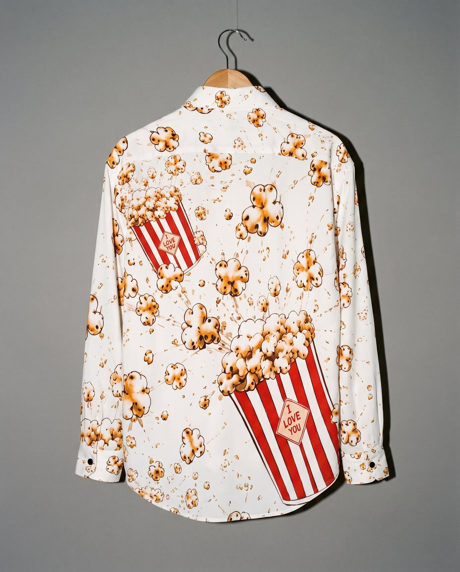 White long-sleeve button-up shirt with popcorn print and I LOVE YOU label back view